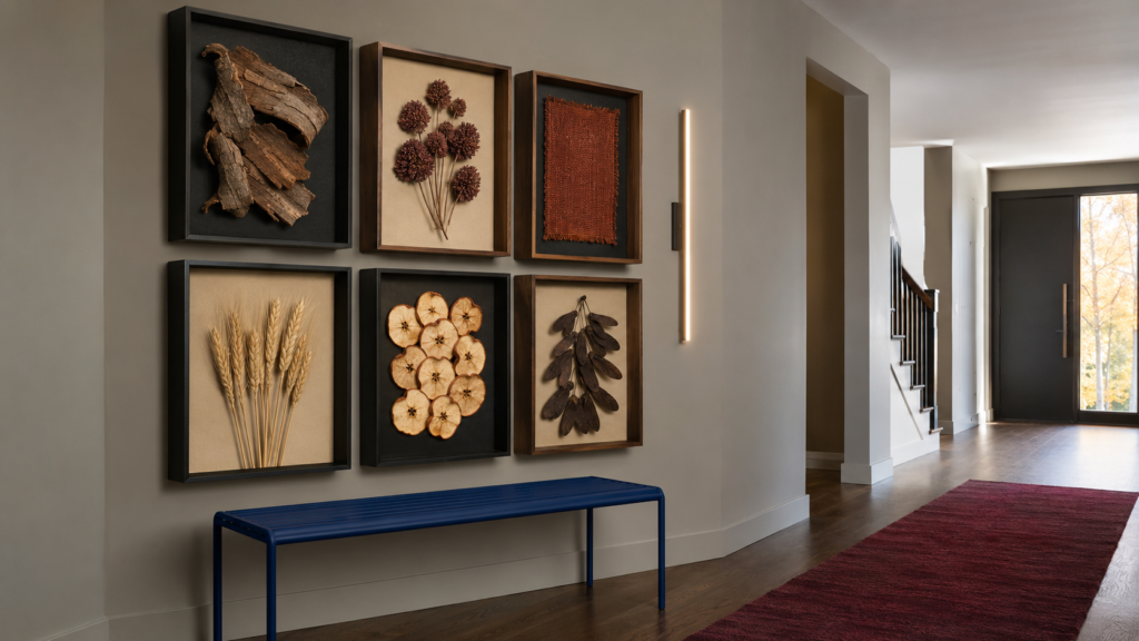 autumn-texture-shadow-box-grid.webp — Modern hallway featuring shadow boxes filled with curated natural autumn textures